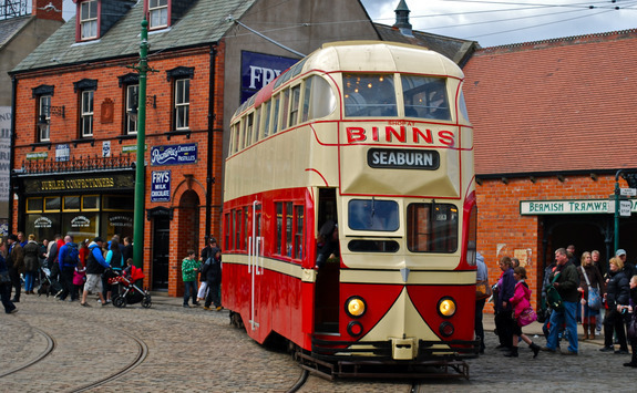 Old bus driving through Beamish museum
